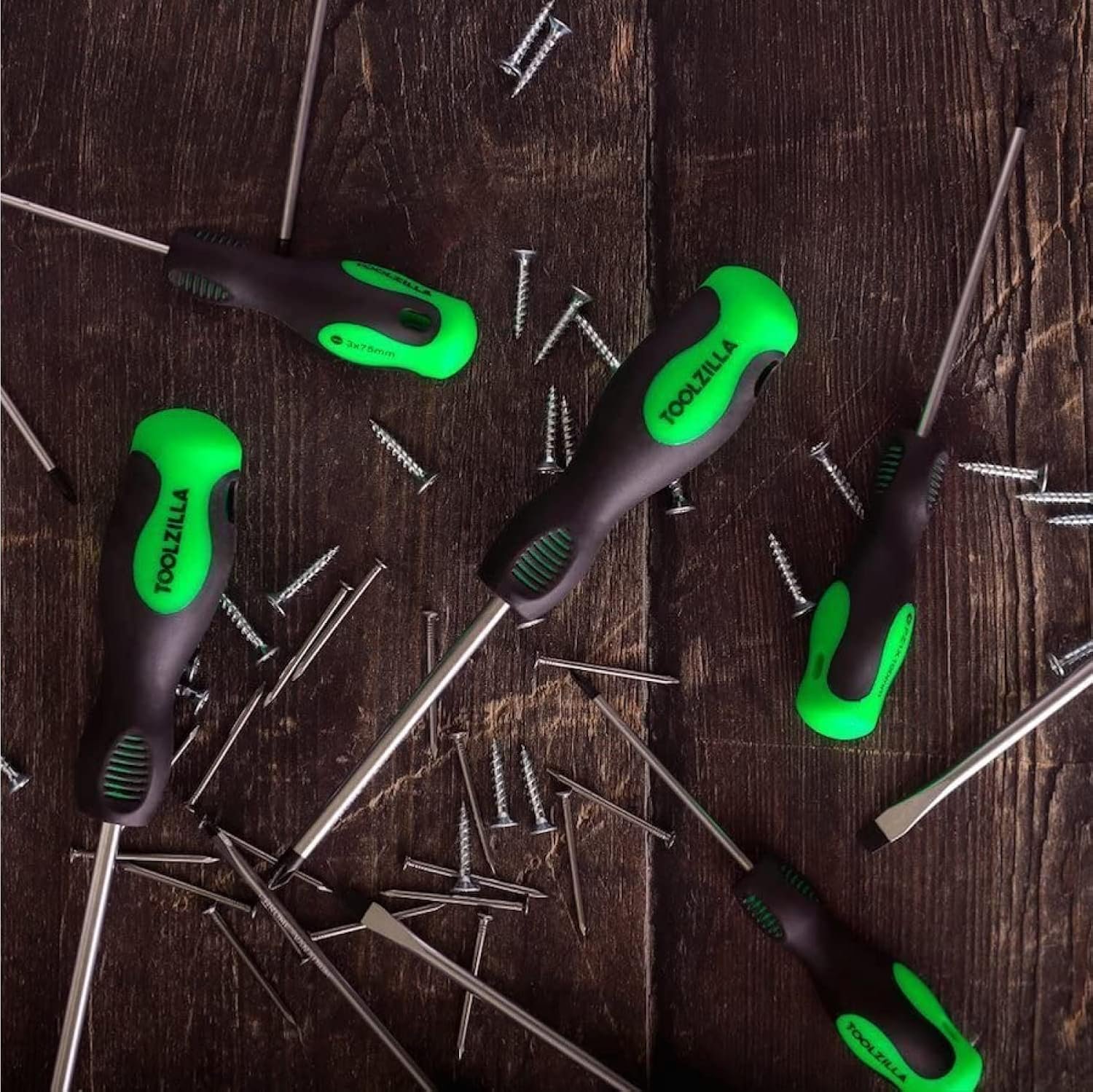 TOOLZILLA PRO Magnetic Screwdriver Set with black and green handles on wooden surface with scattered screws.