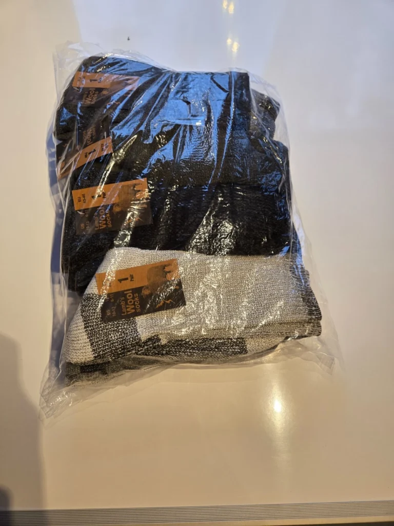 Pack of 5 pairs lambs wool blend socks in black and grey colors in clear plastic packaging