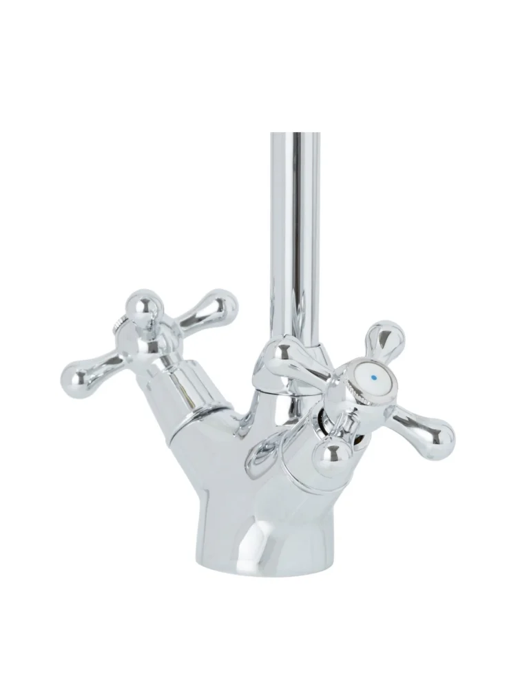Chrome metal faucet with two cross handles and angled cylindrical spout