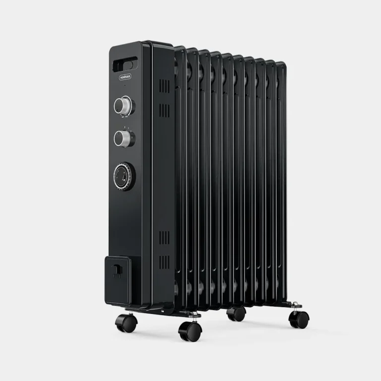 Black metal radiator with vertical fins, two control dials