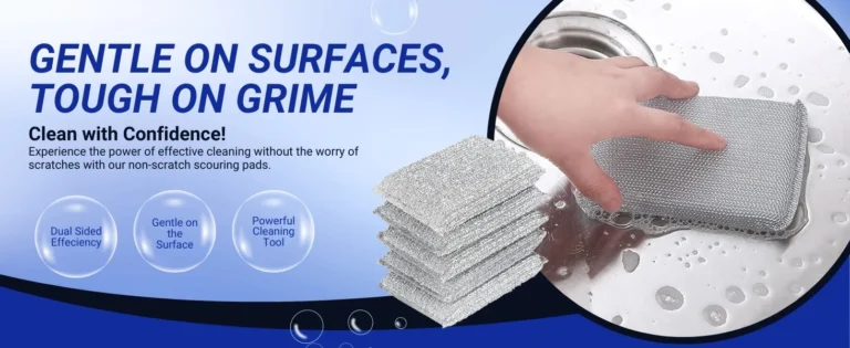 Hand holding a silver metallic cleaning pad on a wet, bubbly surface